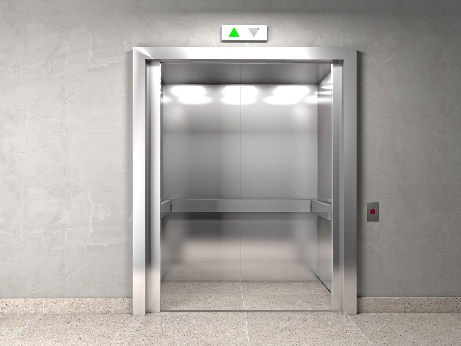 Cabine d’ascenseur moderne en inox brossé, portes ouvertes